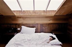 Making the Most of a Small Bedroom. Skylight at the cottage bedroom trimmed with wood