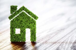 Eco-Friendly Homes: 7 Ways to Update Your Home and Go Green. Green house on the laminated floor