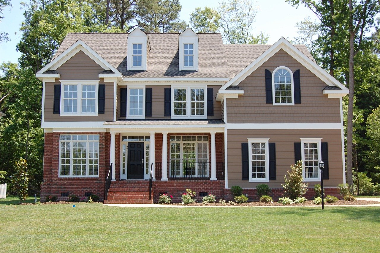 How To Bring Your Vinyl Siding Back To Life. Classic English styled house with gray facade