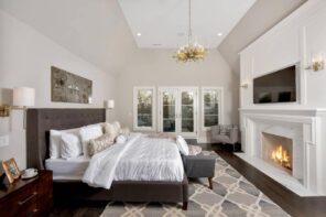 Classic styled bedroom with black framed bed and foam mattress