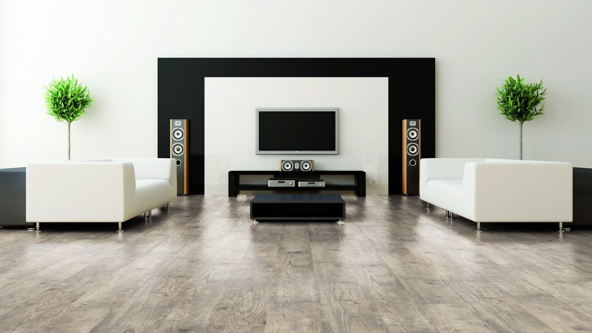 Bright example of minimalism in the living room with black accent on the wall with sound system and TV
