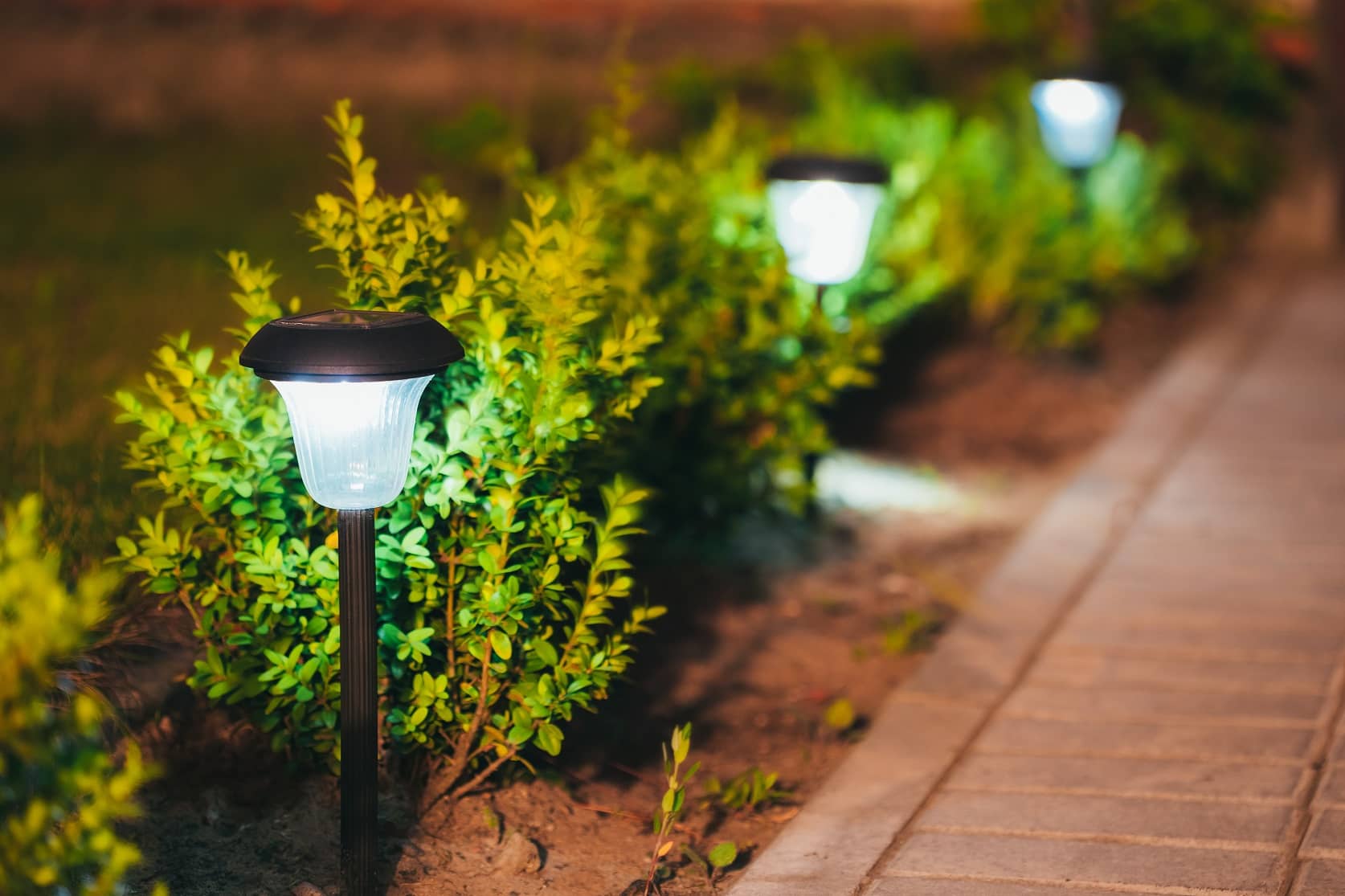 How To Design Your Landscape With Solar Lights. Ground sticking garden lights