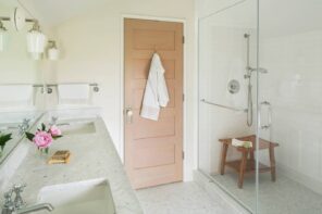 Making the Most of a Small Bathroom. Contemporary styled bathroom in pastel colors with wooden door