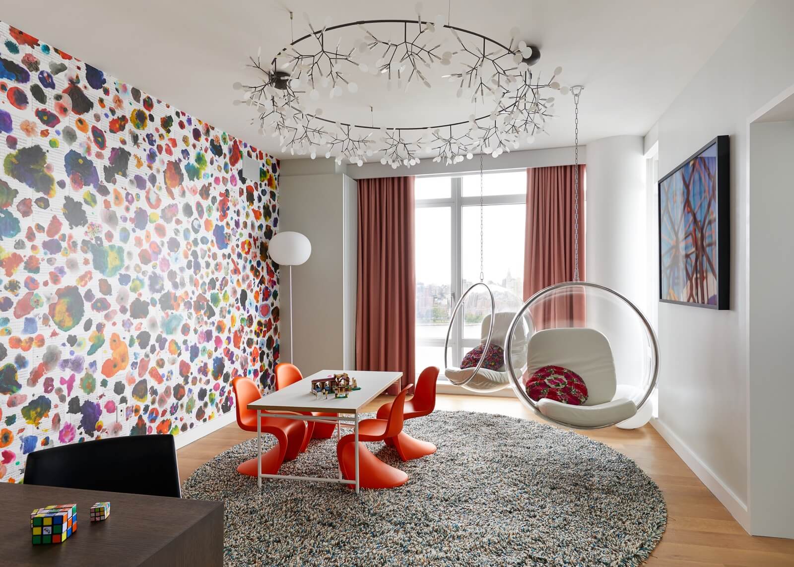 Wallpaper Design Ideas 2020 to Make Interior Elegant. Great idea with orange chairs and colorful impression on the wall