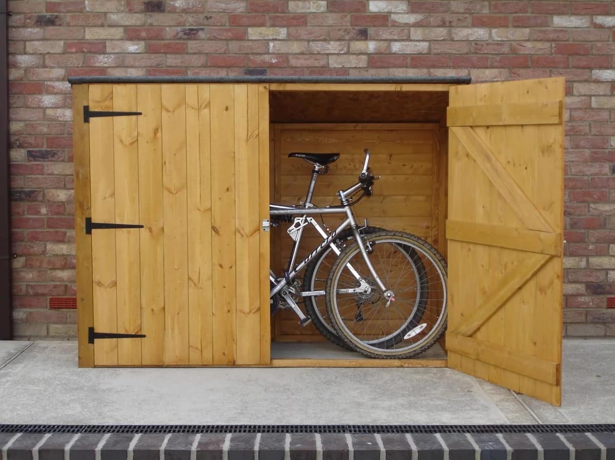 5 Steps to Select the Right Bike Shed. Simple wooden garage for a bicycle
