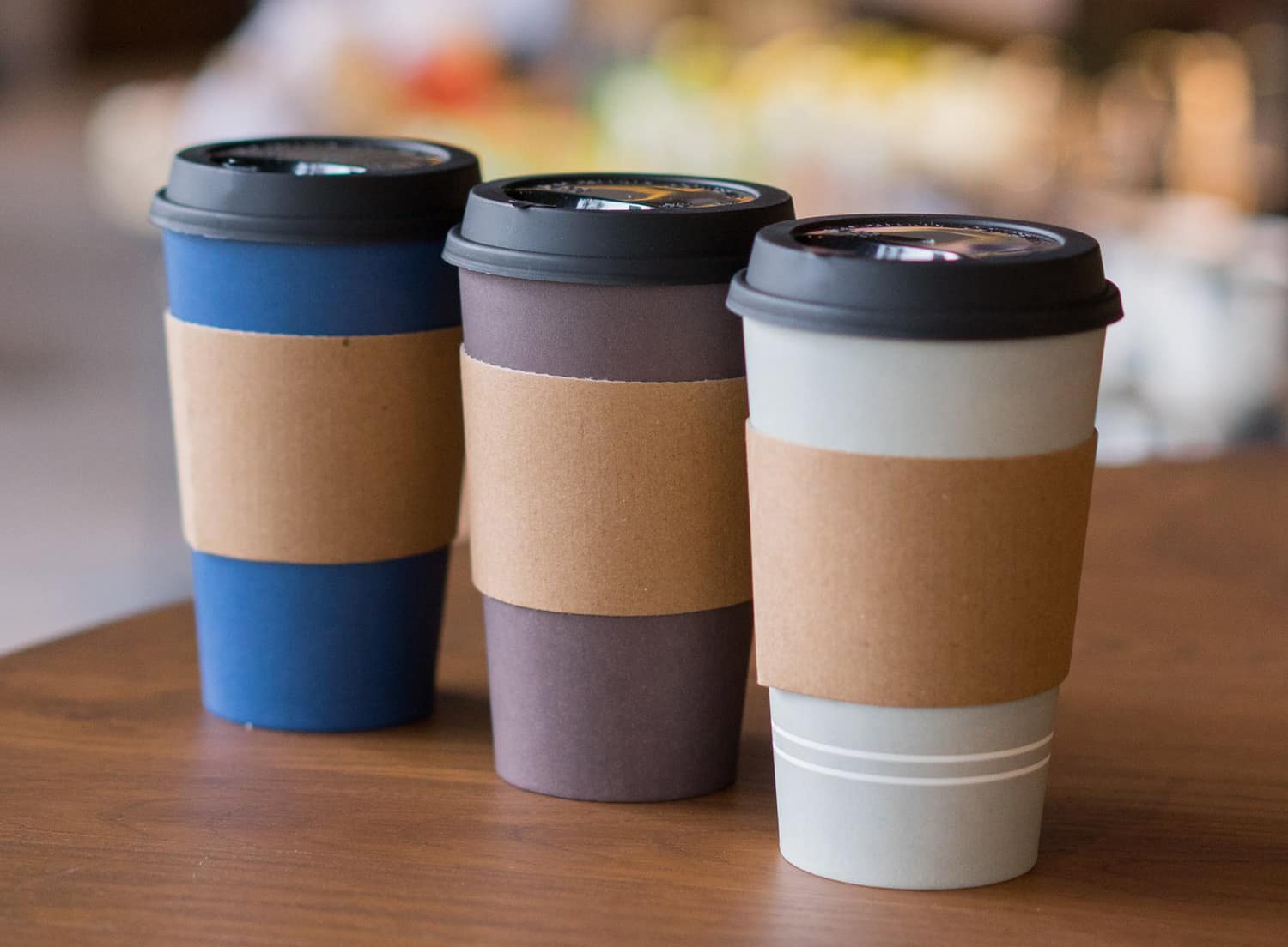 5 Cool Custom Coffee Sleeve Designs That You Should Try! Plastic coffee glass with paperboard sleeve