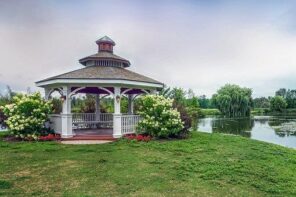 Top Factors to Consider When Creating a Landscape Design. Large multilayered roof pergola at the lake shore with roundish forms