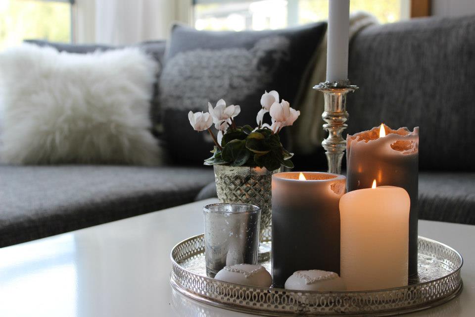 Turning Your Home into Heaven - Smart Ideas to Make it Happen. Cozy Scandinavian interior with fluffy cushions and candles on the tray