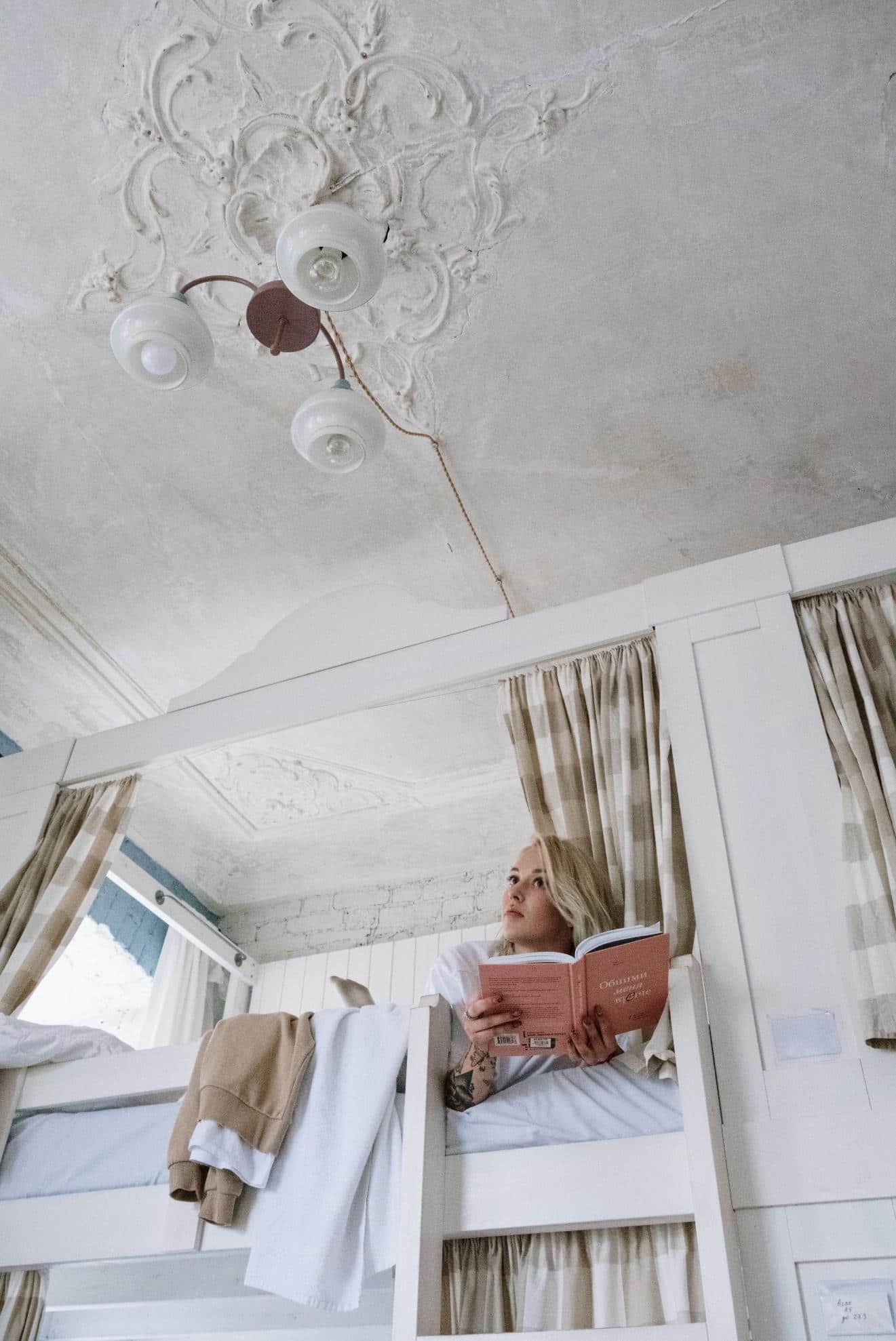 How to Make Your Dorm the Perfect Study Space. Reading and sleeping area at the combined bunk bed