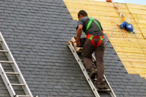 5 Effective Tips for Renovating Your Home's Roof. The roofer shaething the covering layer