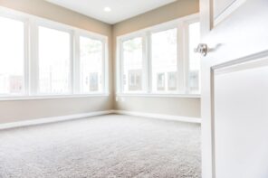 6 Tips To Choosing The Right Flooring. Nice looking modern staged apartment with carpeting and light beige walls