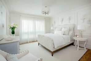 Pastel colored bedroom with large tulled window