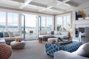 15 Simple Changes That Can Make Your Living Room Much Cozier. Quilted blue ottoman in the great white colored space with coffered ceiling and full if natural light