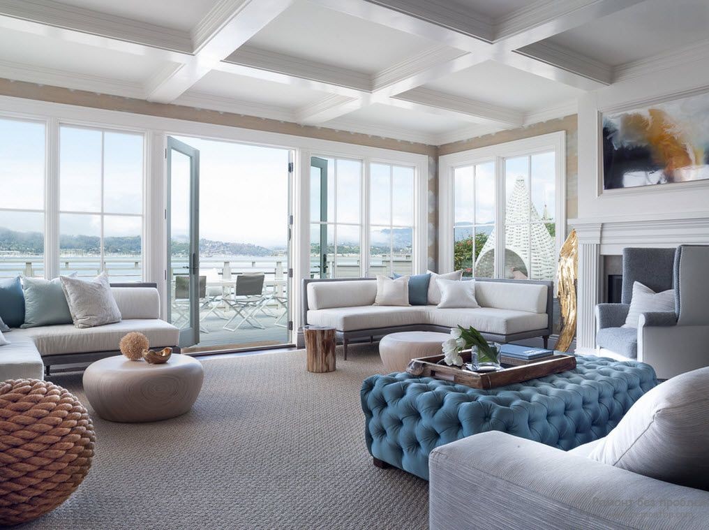 15 Simple Changes That Can Make Your Living Room Much Cozier. Quilted blue ottoman in the great white colored space with coffered ceiling and full if natural light