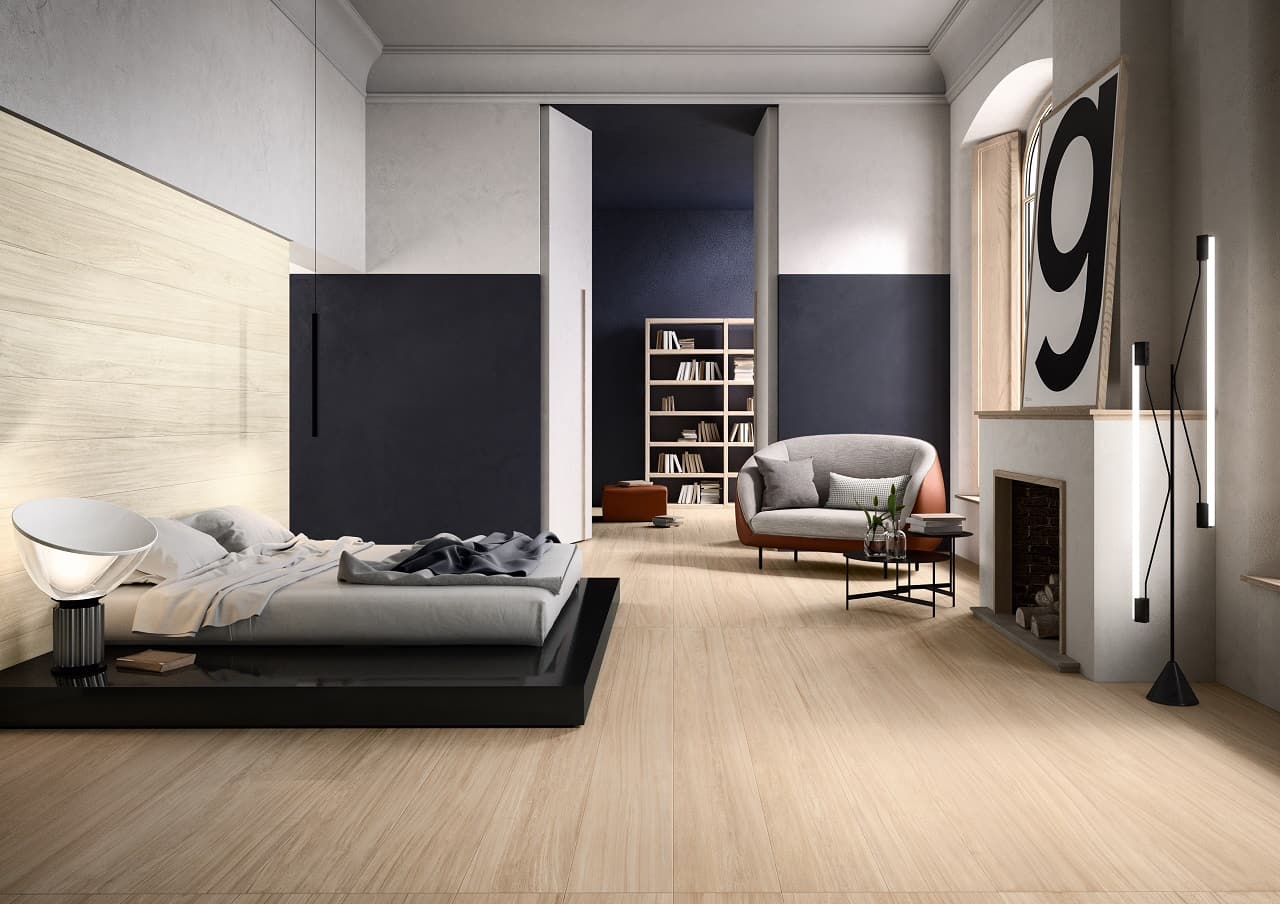 Why Consider Wood Look Tile for Your Next Home Project? Ascetic minimalism in the bedroom with a platform bed and artificial fireplace