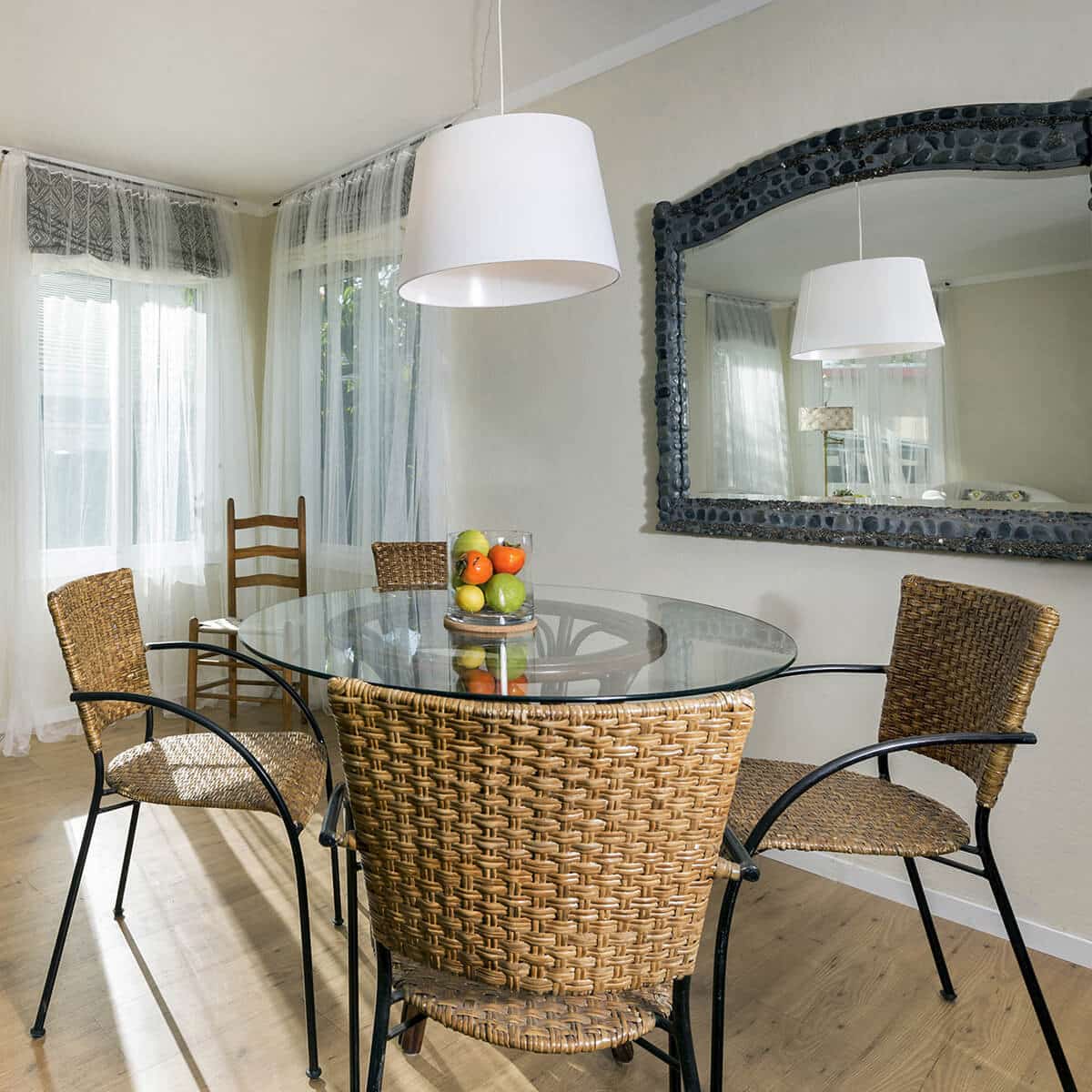 Tempered Glass Round Table Top with a Feeling of Luxury Home Interior Settings. Rattan weaved furniture for casual styled dining