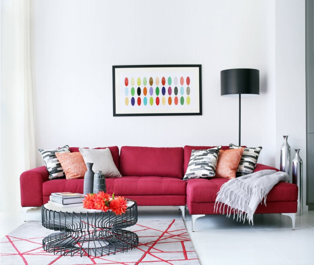 The Best Tips for Living Room Decoration. Simple designed space with round table and red sofa
