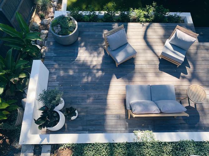 Home Improvements: How to Make Your Patio More Comfortable. Wooden deck and soft blue colored furniture