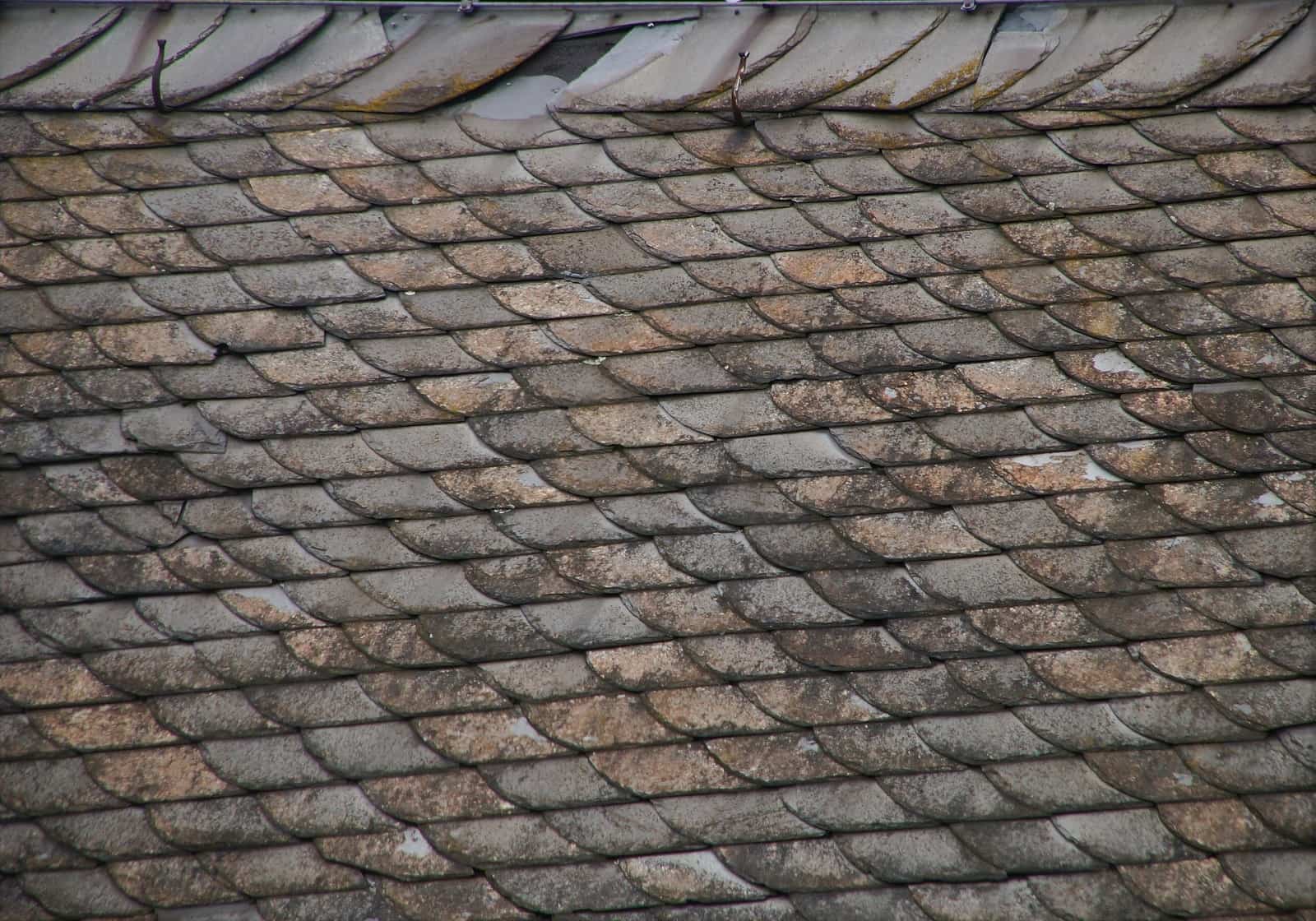 4 Signs That It's Time To Replace Your Roof. Old shingles