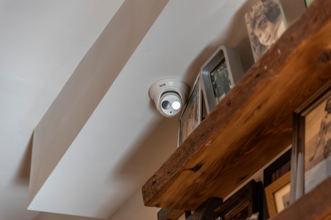 Modern Smart Home Design with Surveillance Cameras. Indoor camera at the book shelving