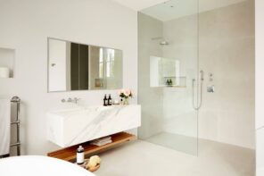 Bathroom Necessities_ 9 Things You Need to Have in Your Bathroom. Stylish contemporary bathroom in pastel creamy tones with hovering vanity and glass shower screen