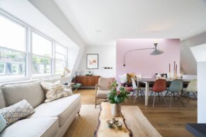 How to Spice Up Your Interior with Accent Walls. Bright pink accent among totally white contemporary living room interior with log table