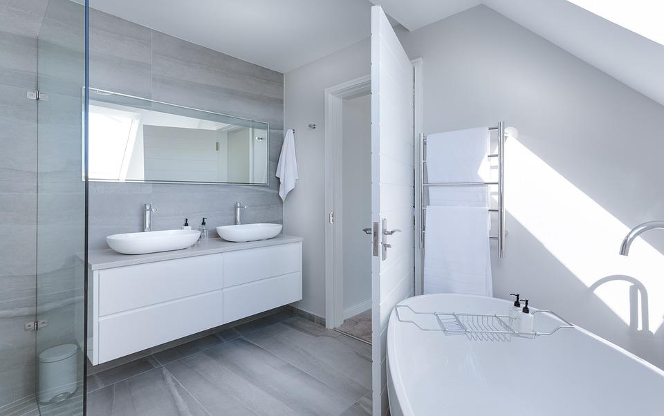 Bathroom Design Trends To Consider When Renovating Your House. Light pastel color scheme for contemporary space with laminated floor