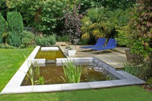 Make Your Garden Your Favorite Hangout Spot. Great landscaping design with ponds and two chaise lounge chairs
