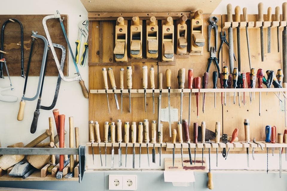 Home Improvements: How To Handle A Chaotic Garage. Tool set at the wooden organizer