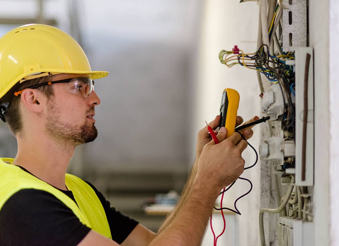 Household Jobs You Should Leave to a Professional. Electrician at the switchboard