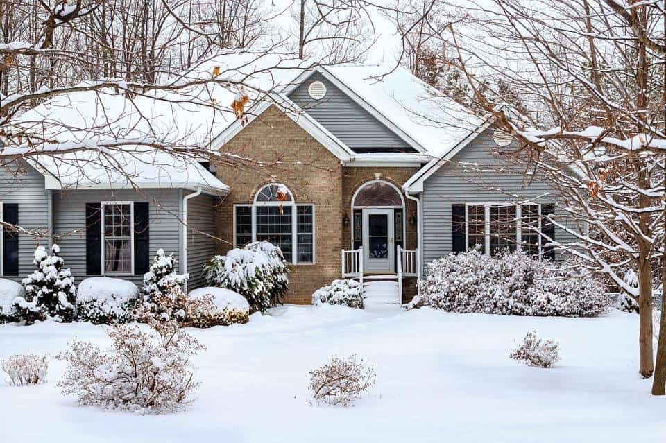 6 Ways to Make the Exterior of Your House Look Better. Typical American house with annexes in snow