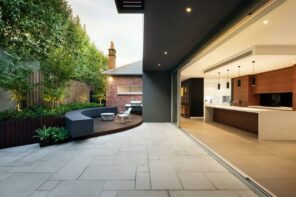 Gardens Through the Decades: Porcelain Paving Stone is the New Cult-Classic of the Next 10 Years. Futuristic and large scale interior design of the backyard of modern house with lounge zone and open side wall