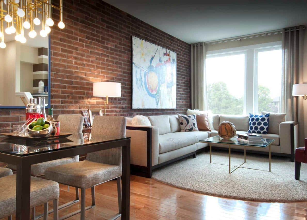 Brick Wall in the Living Room Stylish Interior. Large artwork at the accent wall