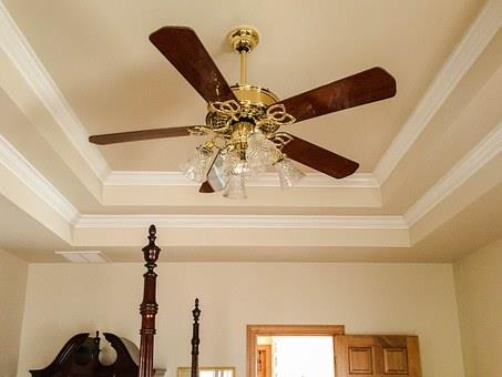 How to Choose a Stylish New Ceiling Fan. Wooden fan for classic interior with mild pastel color scheme