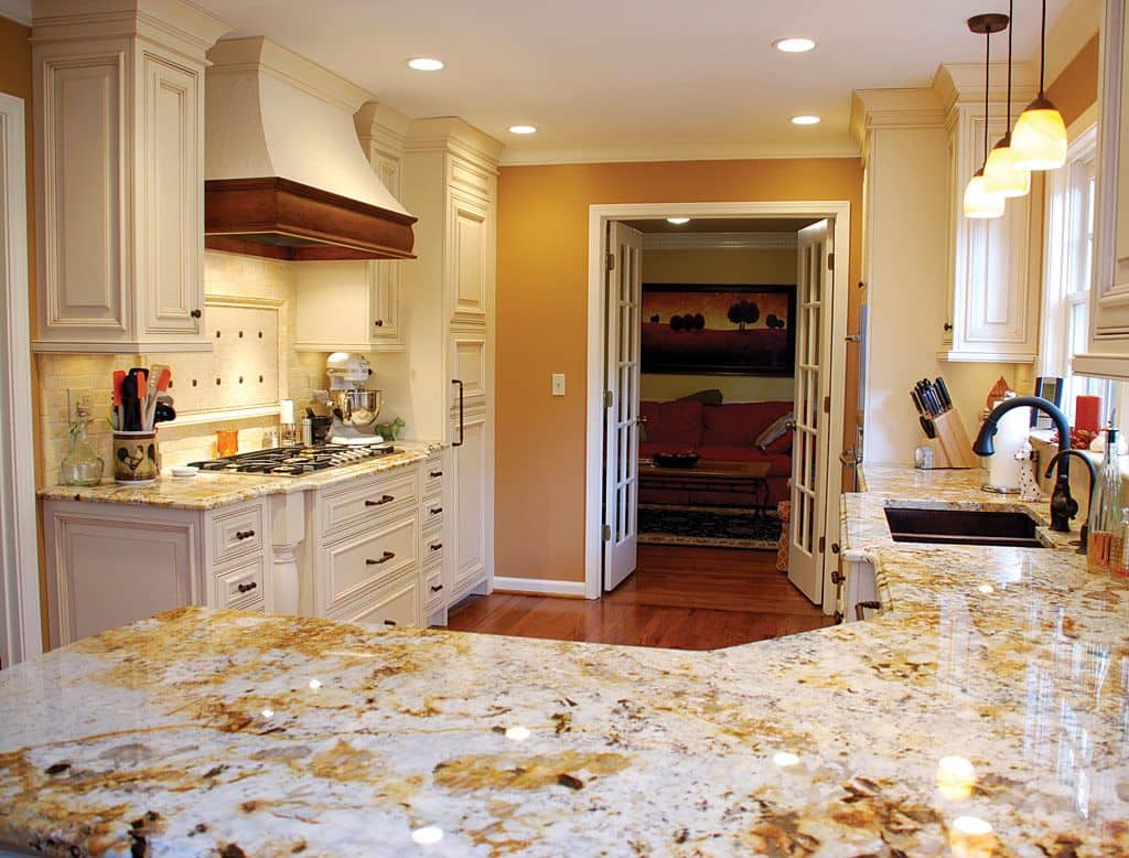Egyptian Style Kitchen Decor and Design Ideas. Chic light colored marble slab countertop and wooden skirting of the hood