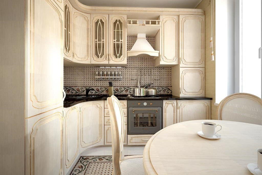 Spanish and Arabic interior design combination for white and gold colored kitchen with classic styled furniture facades and round table