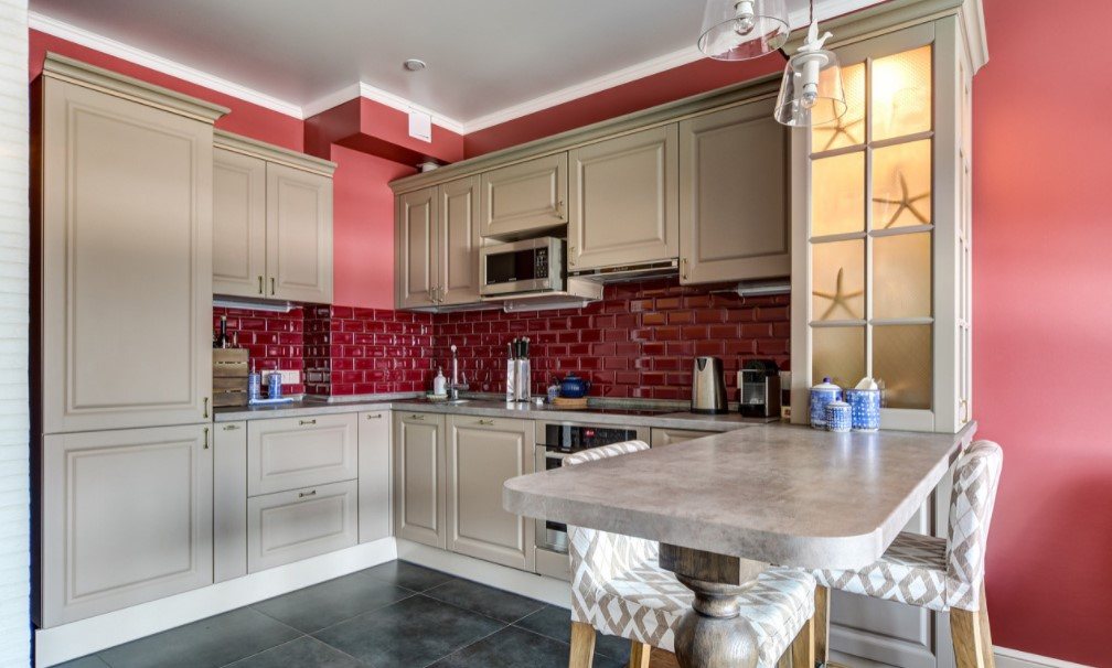 Red brickwork imitating tile, mild beige modular kitchen for quite spacious functional kitchen space