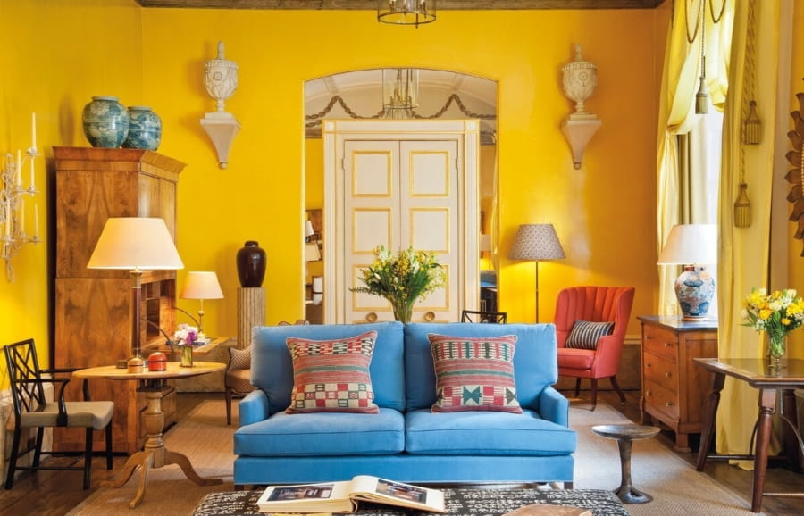 Classic Mediterranean interior full of interior elements and blue sofa in the center