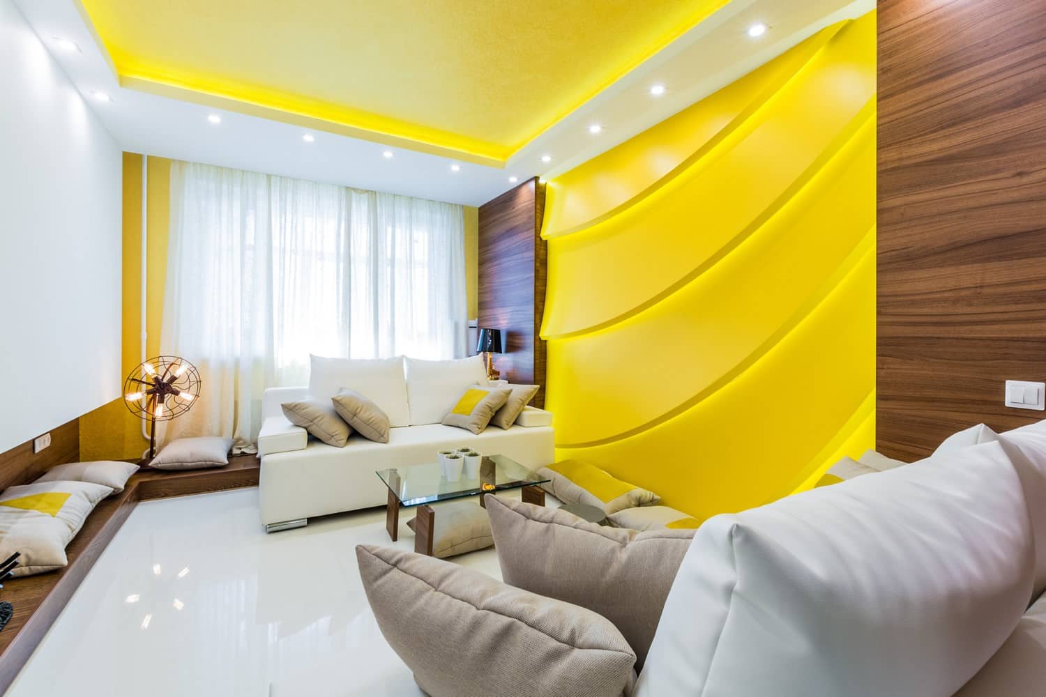 Bright Yellow Living Room Interior Decoration and Design Ideas. Modern wavy wall panels for accent in the high-tech room with perimeter lighting