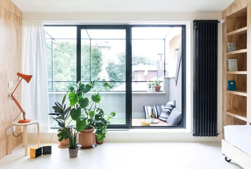 Ultramodern yet minimalistic balcony design with black door