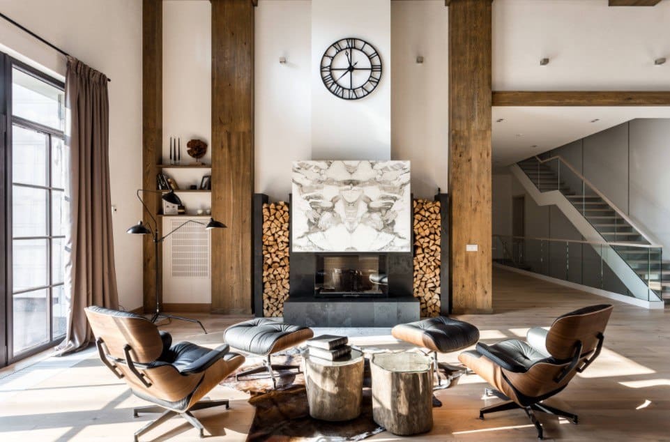 Real chalet in the spacios Scandi designed private mansion with white walls and firewood racks