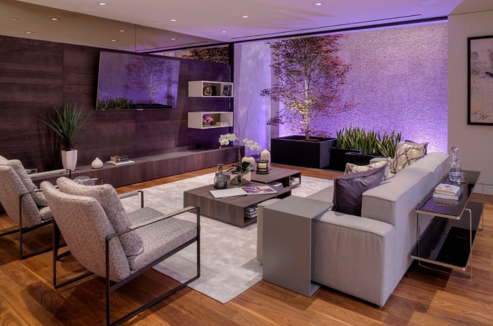 Living Room Interior 2022: Fashionable Design Trends & Ideas. Purple walls and the modern furniture on exposed steel frames