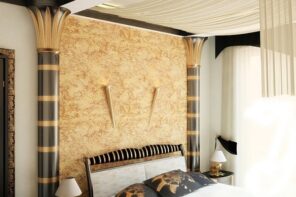 Egyptian Interion Design Style. Typical Egyptian bedroom with black and golden colors as well as semi-columns, textured headboard and pillows with ethic drawings