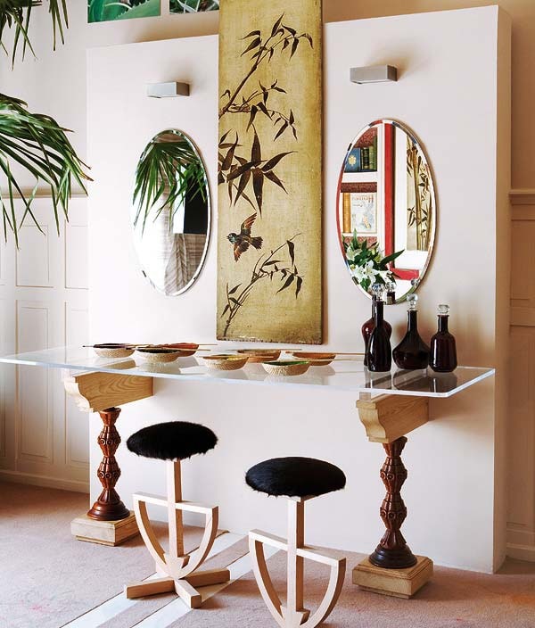Egyptian Interion Design Style. Round stools and mirrors, glass topped table on carved legs