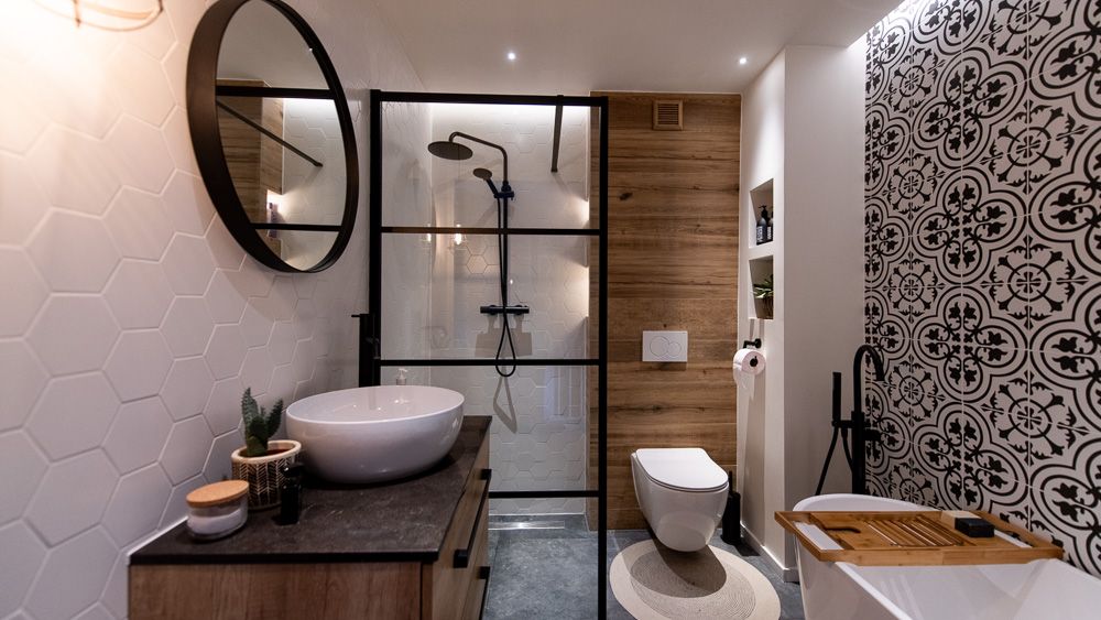 Contemporary styled bathroom with black metal decorations, shower, and wooden inlays 