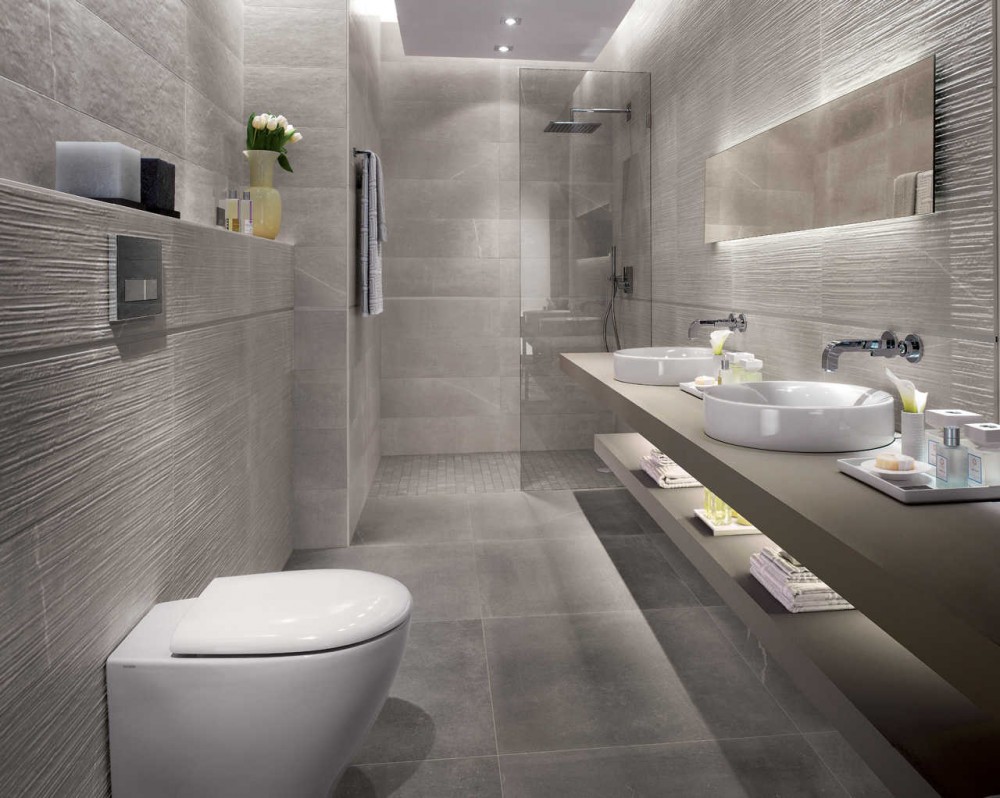 Bathroom Tile Interior Styling and Cladding Ideas. Gray faux concrete tiling for the modern minimalistic loft room 