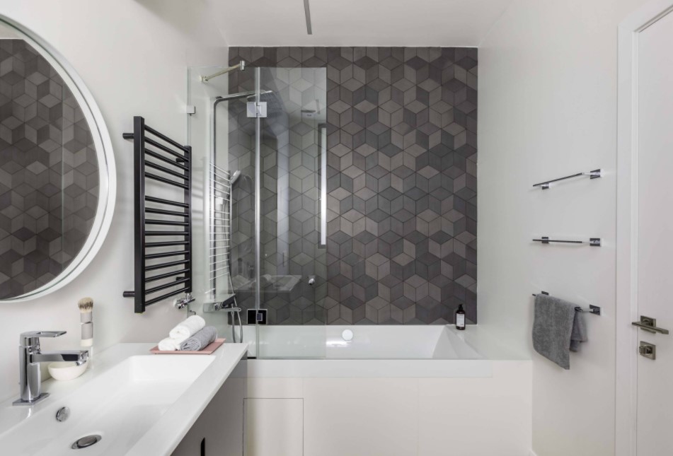 Bathroom Tile Interior Styling and Cladding Ideas. White Casual style modern interior with dark gray heated towel rail and accent mosaic