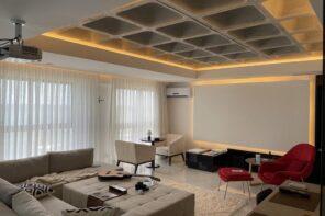 Here’s How to impeccably Decorate Your Studio Apartment Like a Pro. Large cellular ceiling with LED lighting and gray painted walls for intimate minimalistic atmosphere in the room