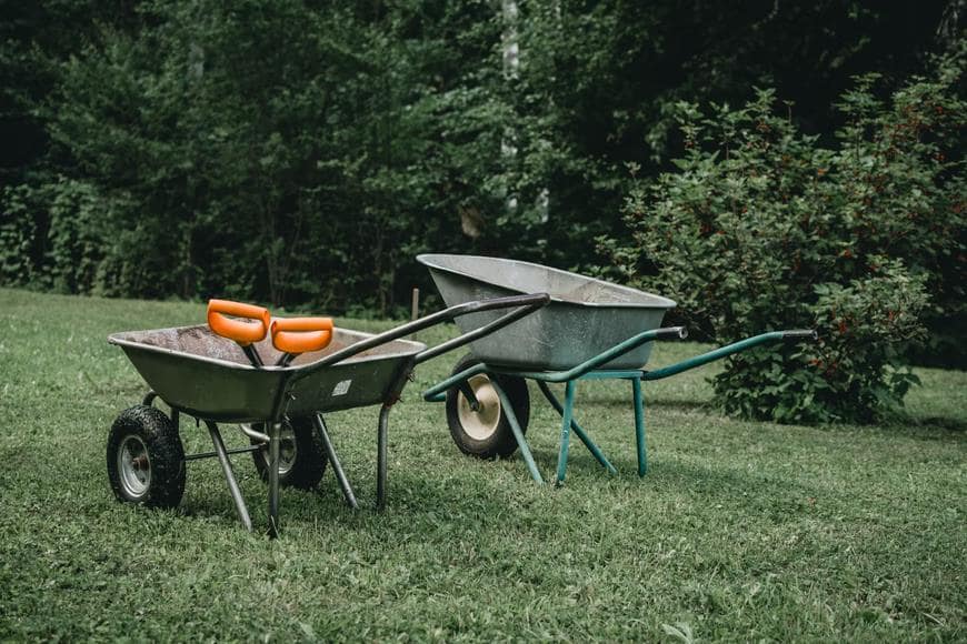 These Essential Tools Will Make Your Yard Work Easier. Wheelbarrows at the land plot