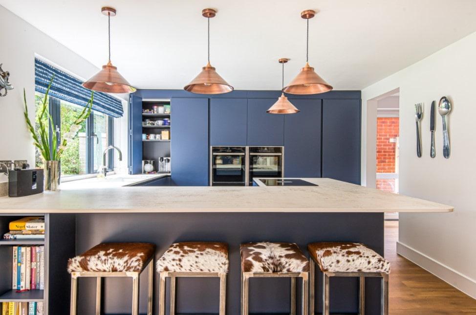 Main Kitchen Interior Trends and Design Ideas 2022. Blue uniform kitchen cabinets and brass pendant lamp set 